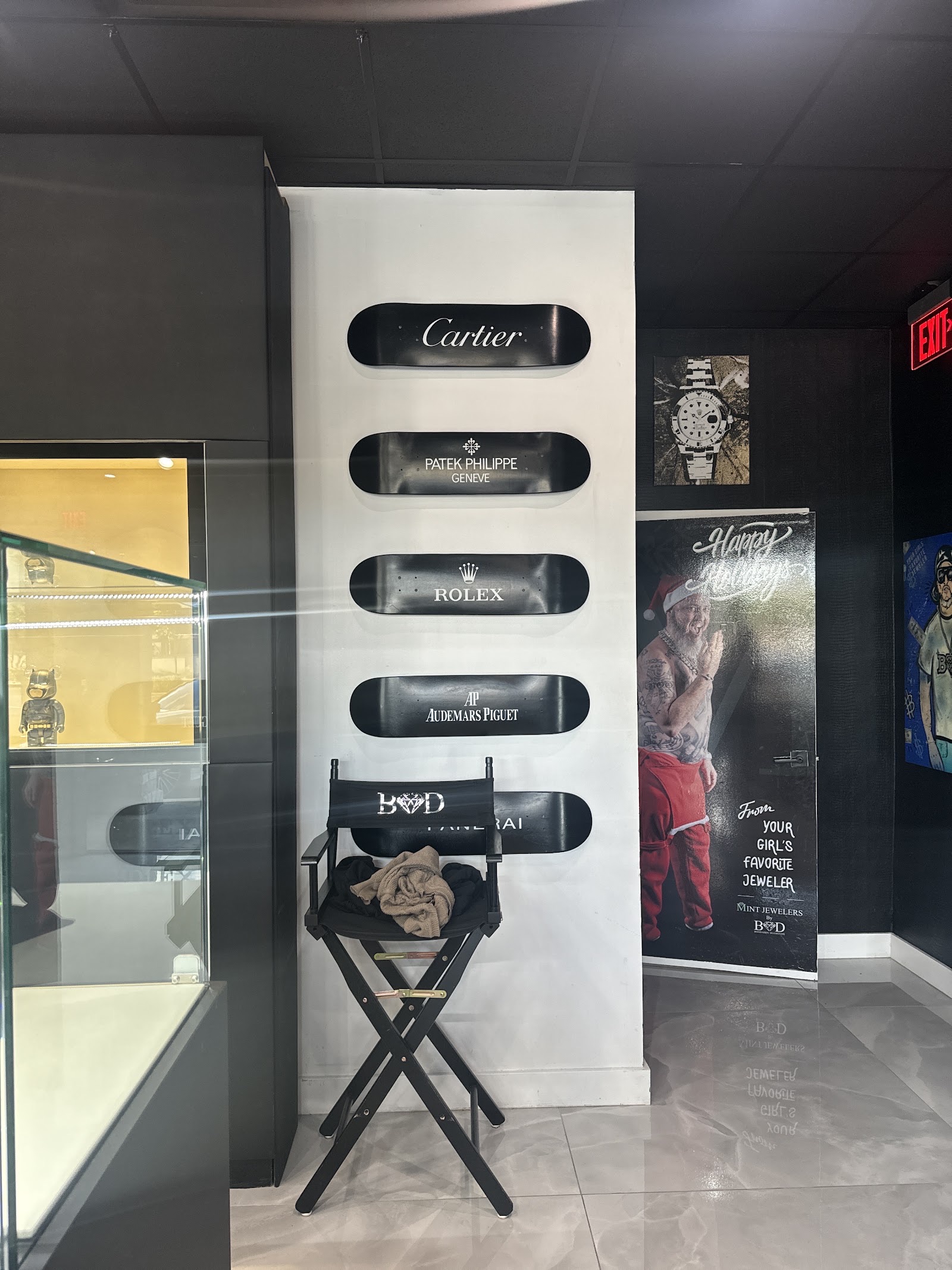 Cartier and Rolex display boxes in the Mint Jewelers watch wall